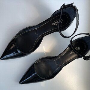 Black patent low-heeled pumps with ankle strap and buckle